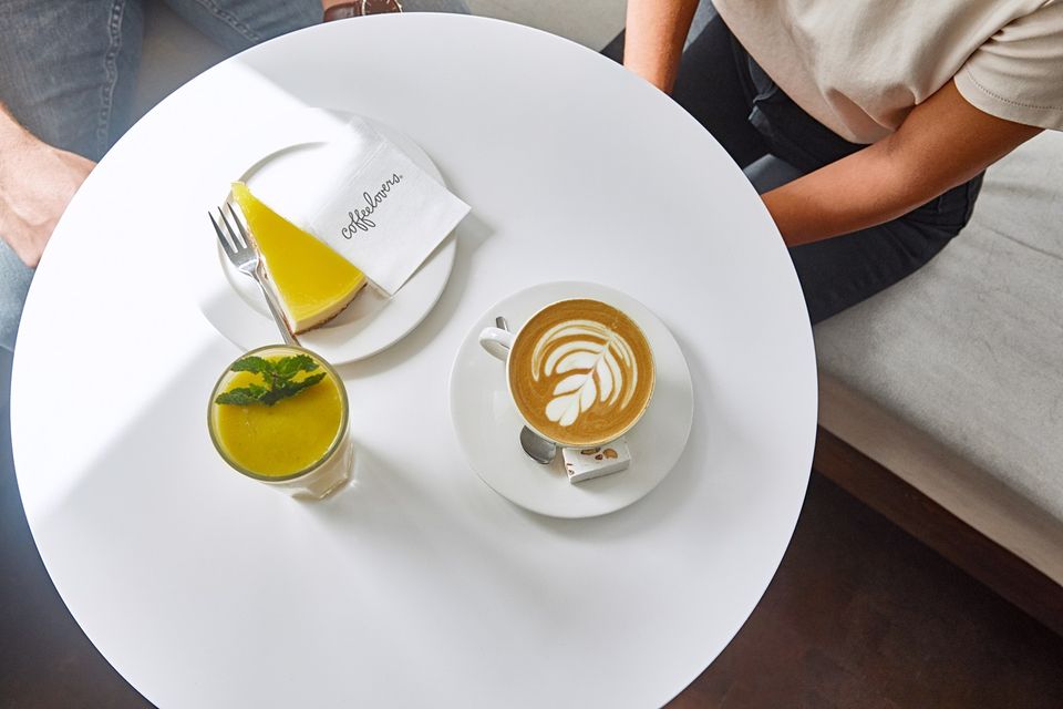 Cofeelovers Maastricht table with pastries and coffee