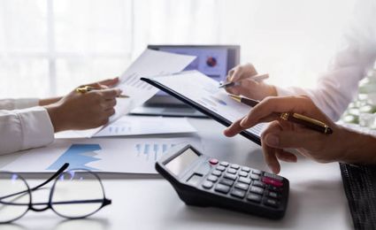People doing their finances at the table.