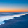 Blauwe uurtje op het strand