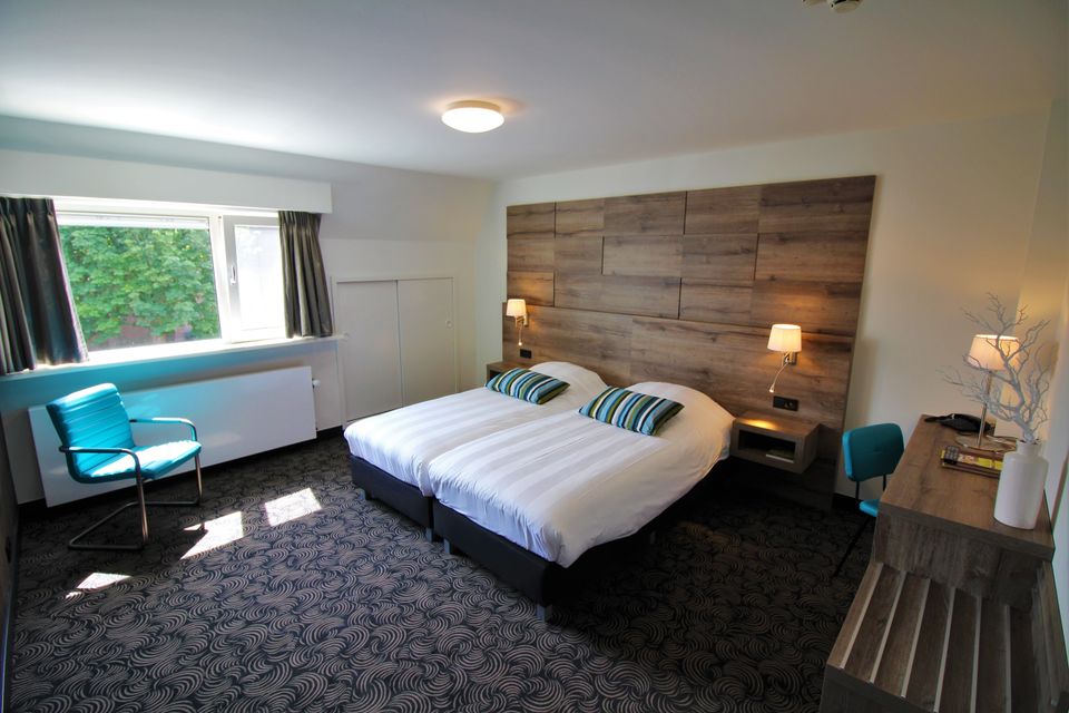 Comfortabele hotelkamer met tweepersoonsbed bij Hotel ’t Wapen van Harmelen in Harmelen, sfeervol overnachten in het Groene Hart.