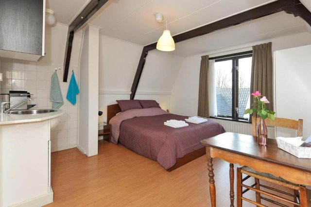 Slaapkamer van Hotel Pension De Harmonie