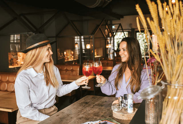 two girls toasting