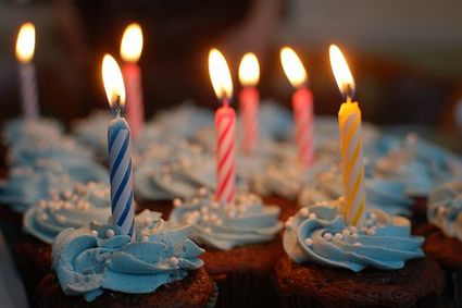 It shows birthday cupcakes with candles.