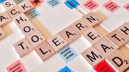 Scrabble board with word blocks.
