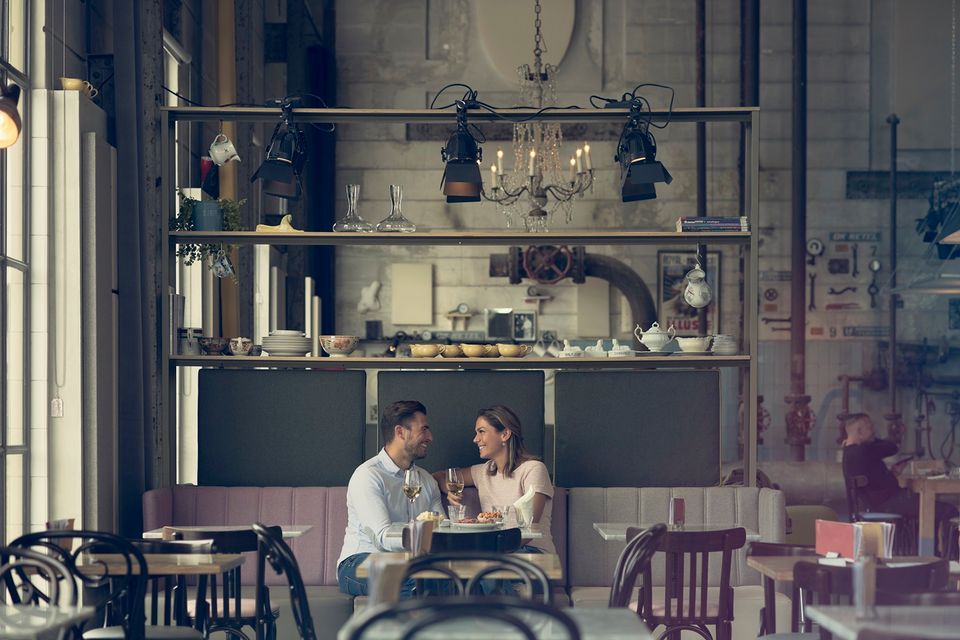 Couple dines at Lumiere in the old Timmerfabriek in Maastricht