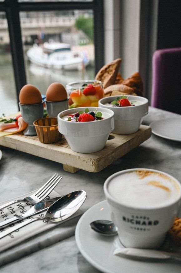 Lumière restaurant Maastricht breakfast shelf with coffee in front of window
