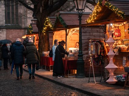 People in front of a stand