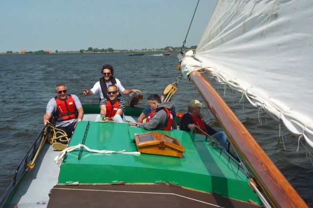 Mannen in een boot op het water, BKU Flevoland