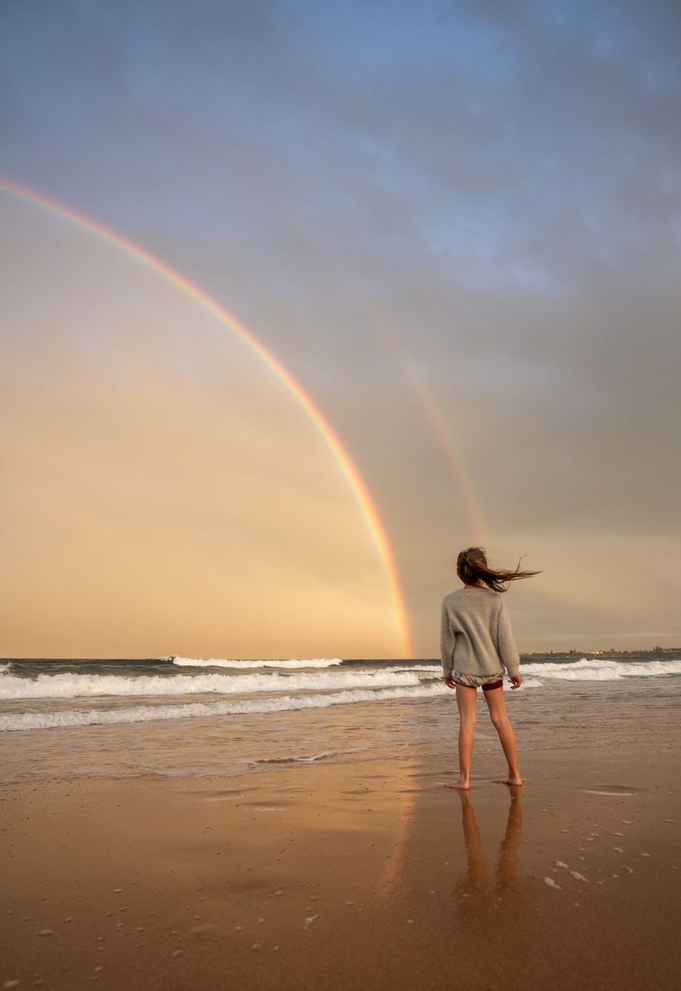 Strand Harlingen met regenbood