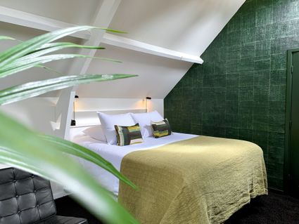 Hotelkamer Hotel Villa Trompenberg in groene, rustgevende tinten.