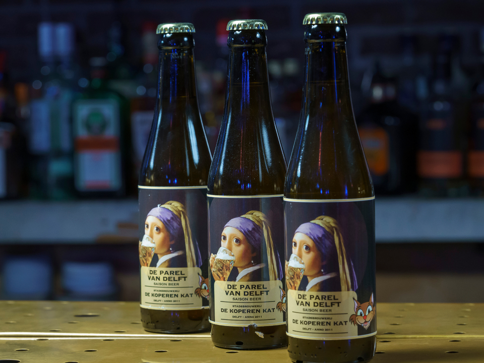 Bierflesjes met speciaal Meisje met de Parel bier van de koperen kat