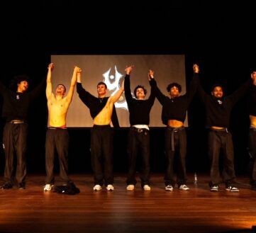 UC Crew op het podium met de handen in de lucht