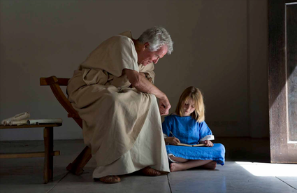 Foto van een leraar (magister) en leerling in Romeinse onderwijssetting.