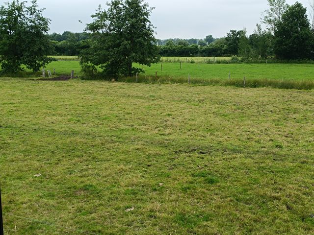 Uitzicht vanuit appartement 4 over de landerijen kijkend naar de kerktoren van Havelte