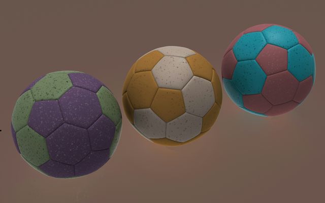 drie gekleurde voetballen