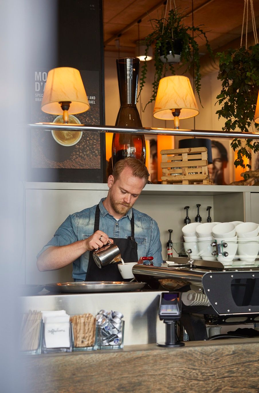 Coffeelovers Maastricht barista behind bar pouring coffee