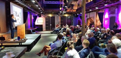 Lecture being held to an audience in one of the rooms at Scheltema