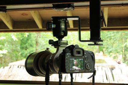 camera die een foto maakt van een vogel