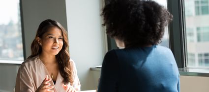 two women having a professional conversation