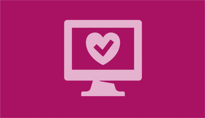 A pink computer with a heart inside