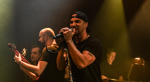 A band singing and playing