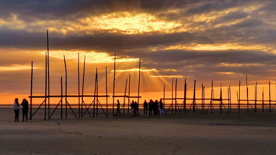 Ondergaande zon bij steiger Vliehors op Vlieland in zomer