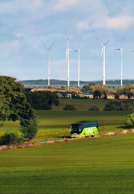 Flixbus en route wind turbines in background