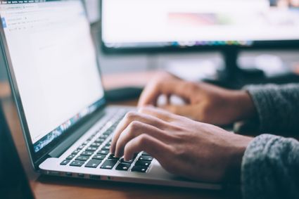 Typing on a keyboard.