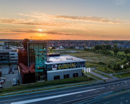 A panoramic view of the CORPUS Congress Centre with a lovely sunset in the background