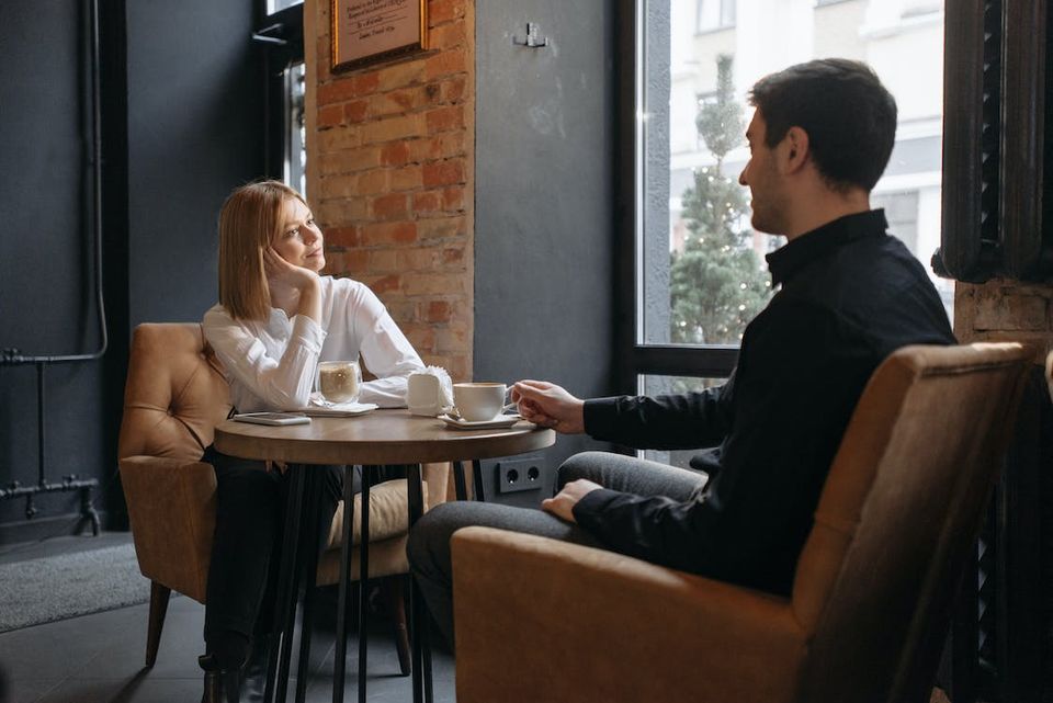 Two people drinking coffee