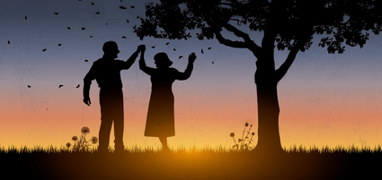 silhouetten van 2 dansende mensen en een boom
