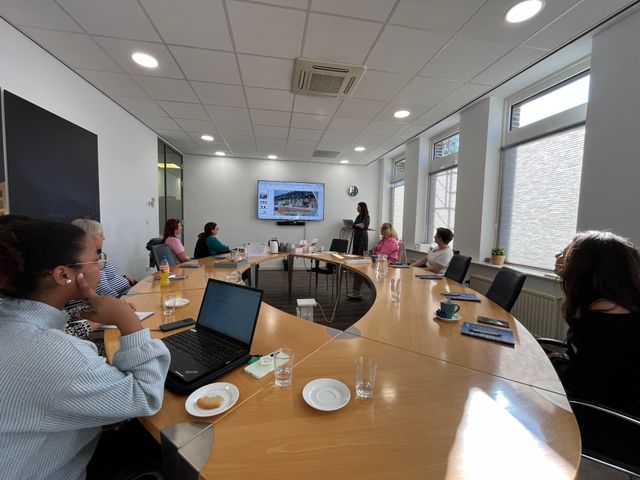 people sitting around a table during a meeting