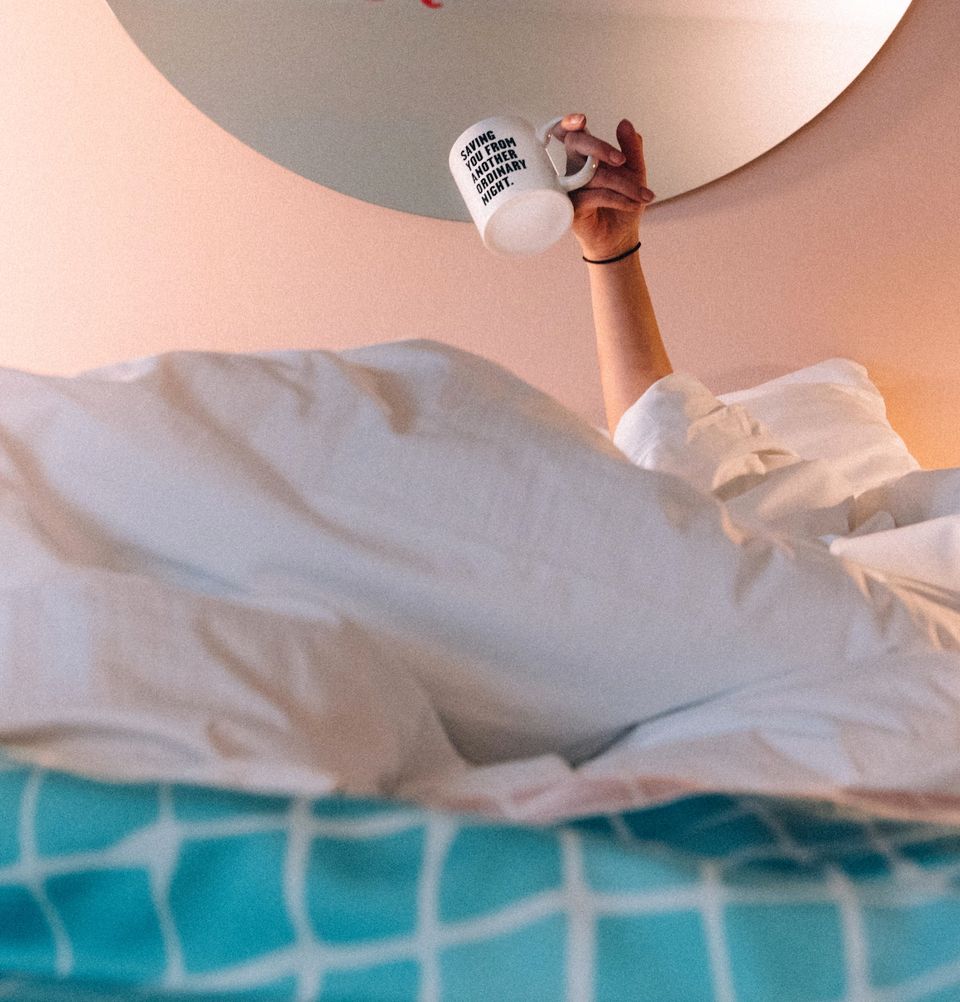 The Dutch hotel Maastricht room one person in bed with mug