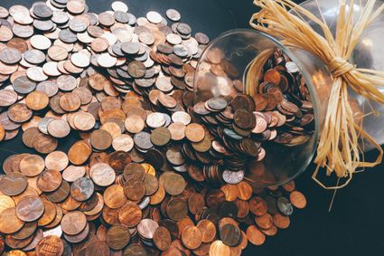 Coins spread out over a table.