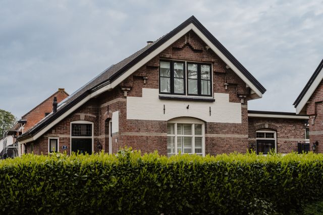 A gable on a former guardhouse that partially protrudes.