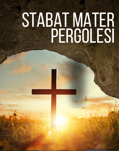 Foto van een kruis in een landschap met ondergaande zon, met op de voorgrond een gedeelte van een rots.