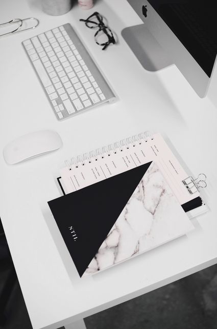 Coffee and papers on a desk.