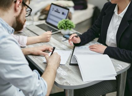 People discussing a contract