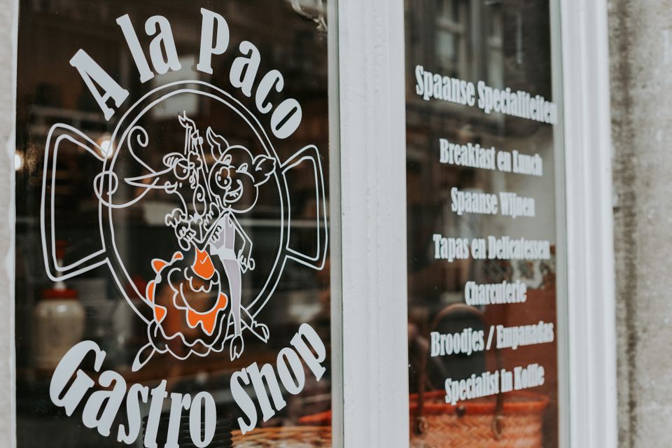 A La Paco Maastricht window with logo