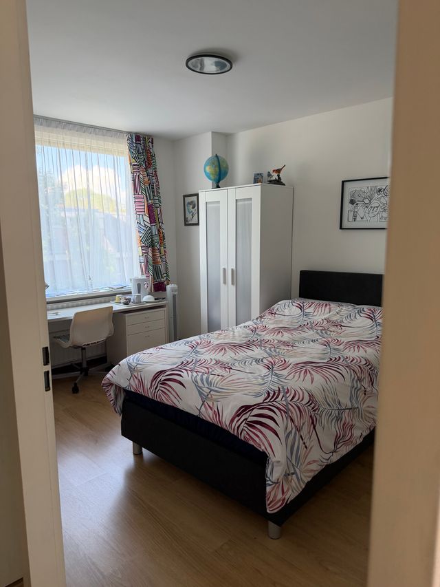 Een slaapkamer van B&B Hendrickje