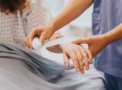 An arm being bandaged.