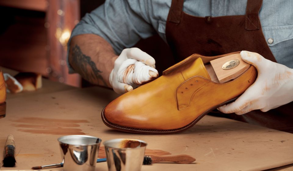 A shoemaker working on a shoe.