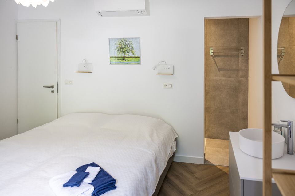 Le Colombier vakantiewoning interieur slaapkamer bed