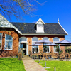 Voorzijde Spijslokaal met terras