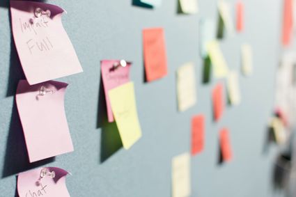 Post-its on a board.
