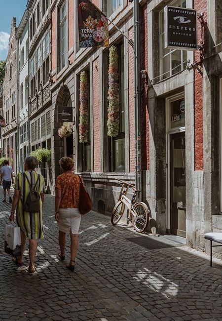 Stokstraat Maastricht shops walking people window display Siefers