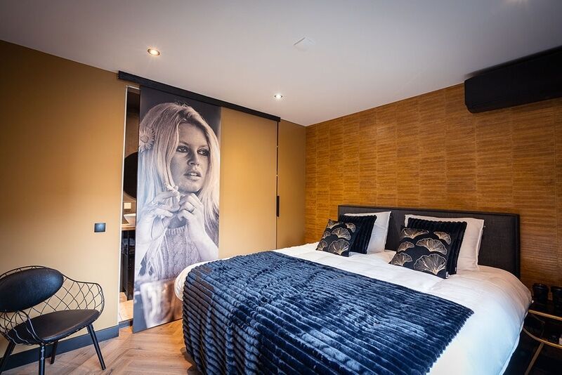 Een slaapkamer van B&B Bardot